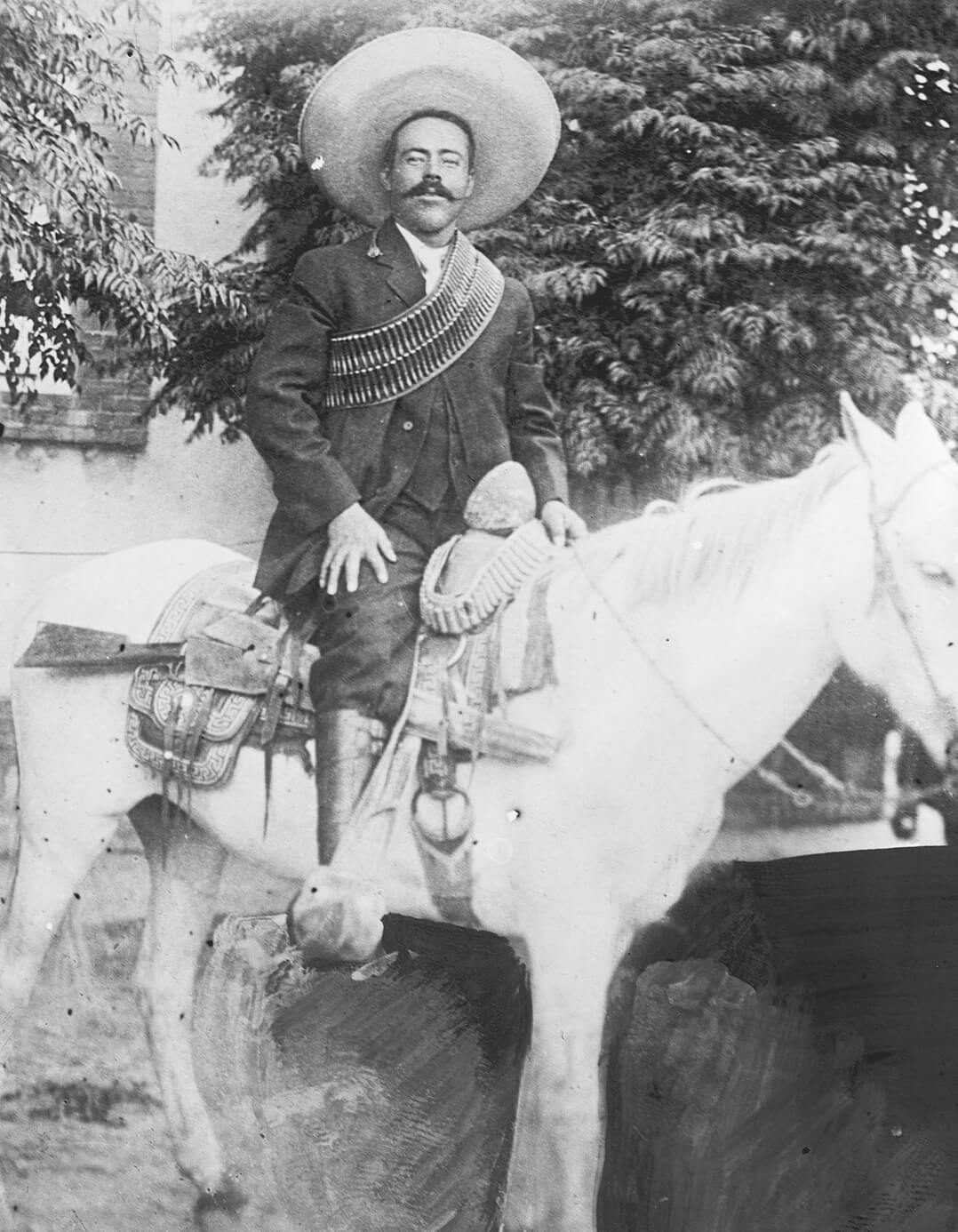 jose doroteo arango, or pancho villa, on a horse
